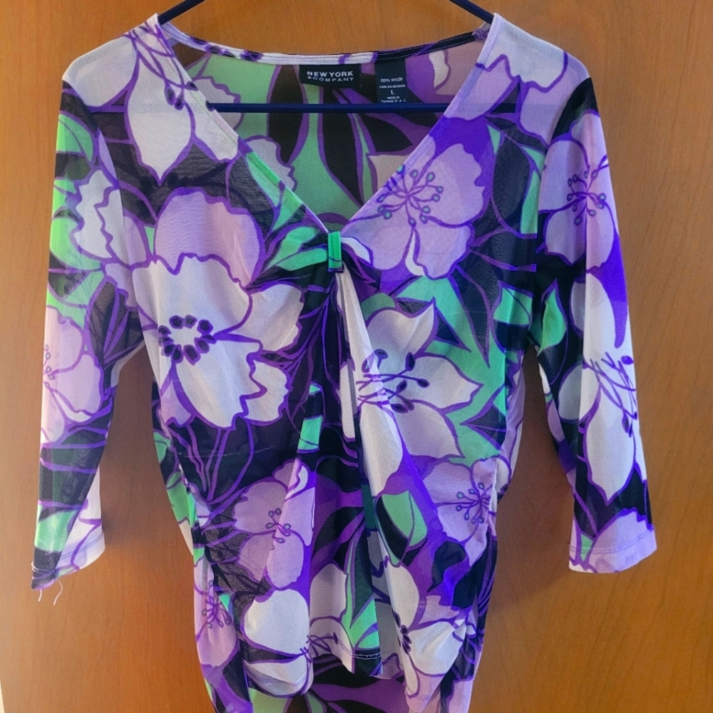 Sheer, mid length sleeves, blouse.